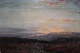 Oil on canvas, view across a landscape at sunset, signed J E Christie?, 25 x 35cm