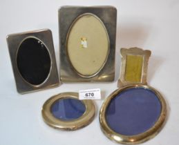Three small silver photograph frames and two plated frames