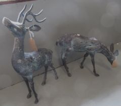 Pair of small brown patinated metal garden figures of deer, tallest 58cm