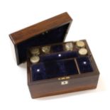 19th Century rosewood dressing case, the hinged cover enclosing a fitted interior with silver