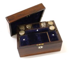 19th Century rosewood dressing case, the hinged cover enclosing a fitted interior with silver