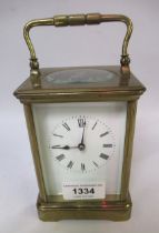 French gilt brass carriage clock, the enamel dial with Roman numerals, with a two train movement