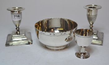 Pair of London silver candlesticks on square bases (one at fault), silver egg cup and a Sheffield