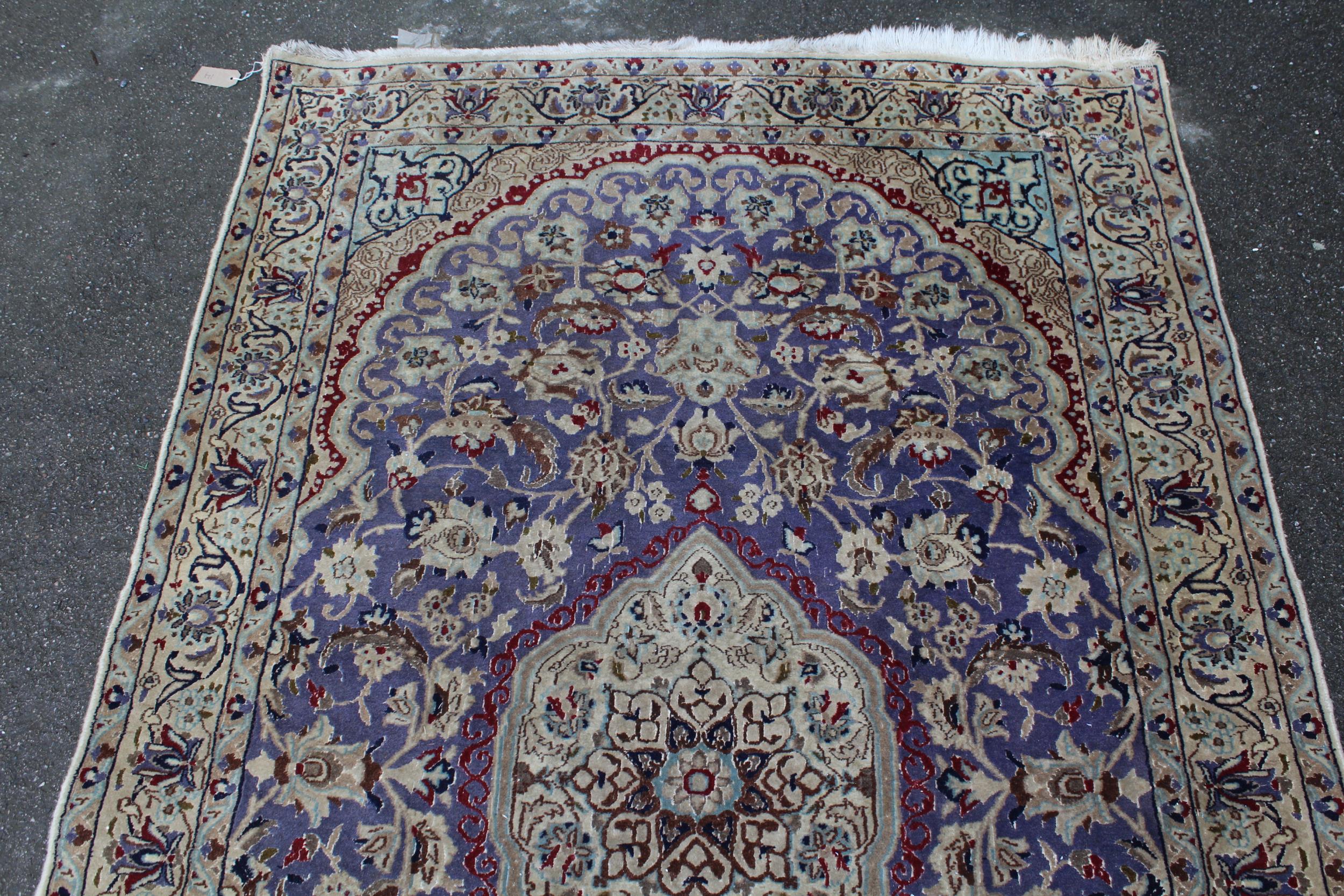 Indo Persian rug with a medallion and all-over palmette design on a mauve ground with borders, 216 x - Image 2 of 4