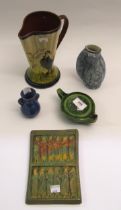 Brannam for Liberty green glazed pottery oil lamp, and a small Brannam blue glazed vase, two further