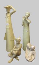 Group of four studio pottery figures, the tallest of a lady holding a bonnet, 54cm high, the