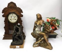 Bronze patinated resin figural group ' The Kiss ', another of a seated female, a mantel clock and