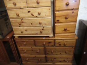 Large reproduction pine chest of drawers with knob handles, together with two similar smaller chests