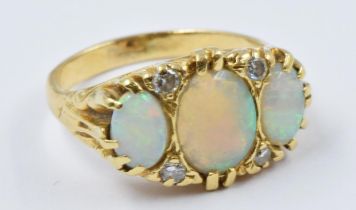 Yellow gold ring set three oval opals and four diamonds, 6.6g, size O