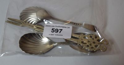 Three various silver caddy spoons and two pickle forks
