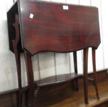 Edwardian mahogany drop-leaf Sutherland table with a shaped top on carved and shaped supports with