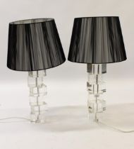 Pair of 20th Century Jackie Moore glass designer table lamp bases, having black shades, 73cm high (