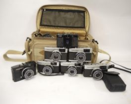 Camera bag containing six 35mm Olympus Trip 35's including one Limited Edition in black, together
