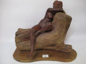 Late 20th Century patinated terracotta and carved wood sculpture, the ceramic portion in the form of