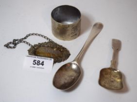 Silver caddy spoon, antique silver coffee spoon, napkin ring and a wine label together with a
