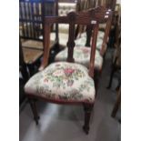 Set of four late Victorian walnut dining chairs, with floral upholstered seats, on turned fluted