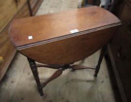 Small late 19th Century walnut circular drop-leaf occasional table on turned supports, with shaped