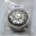 White metal covered yo-yo with embossed decoration engraved with initials I.M.M.