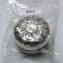 White metal covered yo-yo with embossed decoration engraved with initials I.M.M.