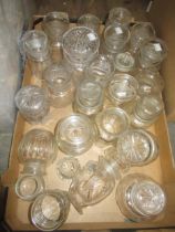 Collection of cut glass preserve jars with covers