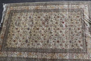 Mid 20th Century Indian carpet with an all-over palmette and animal design on an ivory ground with