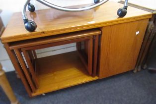 Mid 20th Century teak fold-over occasional table with integral cupboard and nest of tables, 88cm