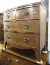 Small 19th Century mahogany bow front chest of two short and two long drawers, with oval brass