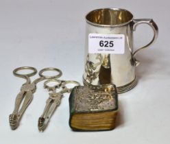 Birmingham silver Christening mug, two pairs of silver sugar nips and a small silver mounted book of