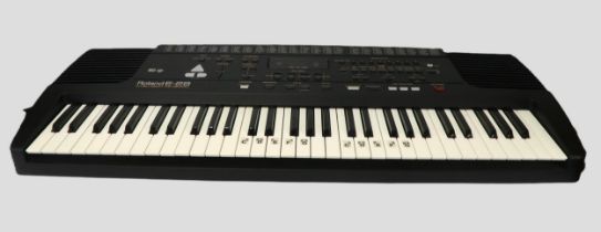 Roland E28 electronic keyboard with stand