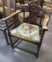 1930's Oak tub shaped chair, with carved crested back