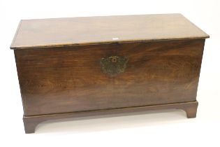 Large 19th Century mahogany trunk having single plank top with original escutcheons and side handles