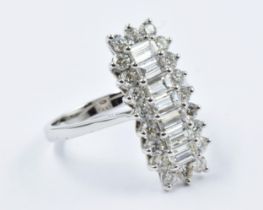 18ct White gold ring set seven baguette and twenty one brilliant cut diamonds, approximately 2.