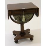 William IV rosewood drop-leaf work table with a single drawer above wool bag, raised on turned