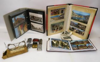 Pair of mid 20th Century safety spectacles, small quantity of cigarette lighters and three albums of