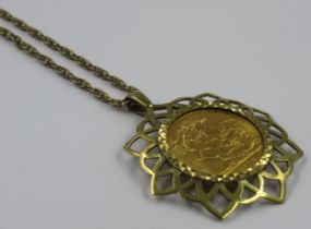 Full sovereign dated 1974 in a 9ct gold mount on a yellow metal chain, gross weight 17.5g