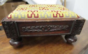 Low rectangular footstool with carved applied decoration on bun supports and a two handled log