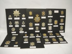 Collection of military cap badges mounted on six cards