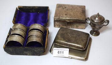 Set of six Victorian silver napkin rings, silver cigarette box, two silver cigarette cases and a