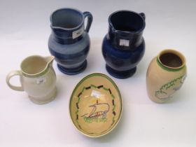 Ashtead Potters two blue glazed jugs, 17cm high, another smaller jug in white, a vase decorated with