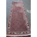 Modern Bidjar runner with all-over Herati design on a rose ground with floral border, 292 x 97cm