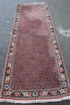 Modern Bidjar runner with all-over Herati design on a rose ground with floral border, 292 x 97cm