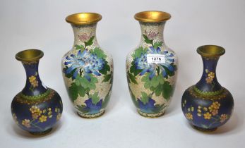 Pair of cloisonne baluster form vases decorated with chrysanthemums on white ground and another pair