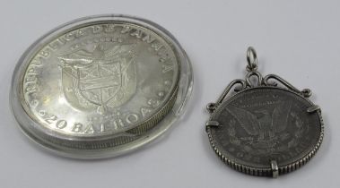 Silver Panama 20 Balboas coin, 1974, together with a United States of America silver dollar, 1885,