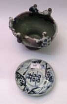 Chinese provincial porcelain saucer painted with fish, together with a Chinese stoneware bowl with