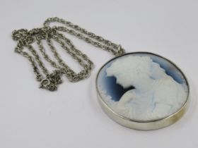 Circular silver mounted glass portrait cameo pendant on a silver chain