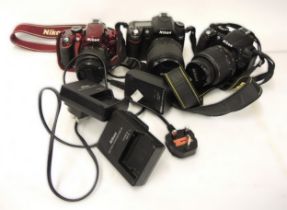 Nikon D3200 digital camera with lens, and two others, D3100 and D80, all with lenses, straps and