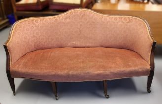 George III mahogany humpback sofa with moulded frame on square reeded supports with later casters,