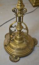 Late 19th / early 20th Century brass oil lamp standard with ornate tripod base, 164cm high overall