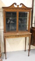 Edwardian mahogany and marquetry inlaid display cabinet, the swan neck pediment above a pair of