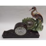 Unusual porcelain mantel clock in the form of a heron with lustre finish, together with another